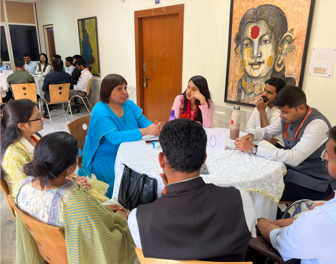 A small-group dialogue unfolding at a Living Stories Collective event.