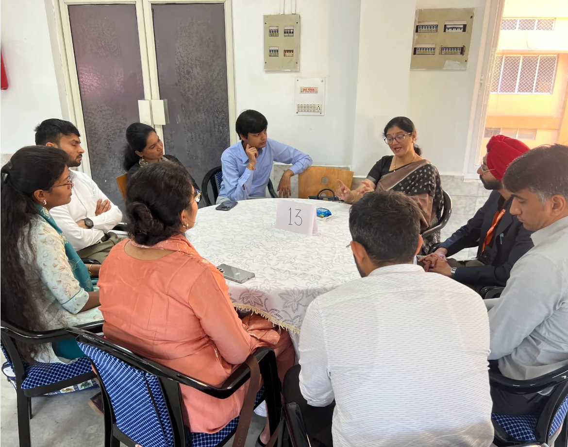 Participants exchange perspectives around table 13 during a Living Stories session.